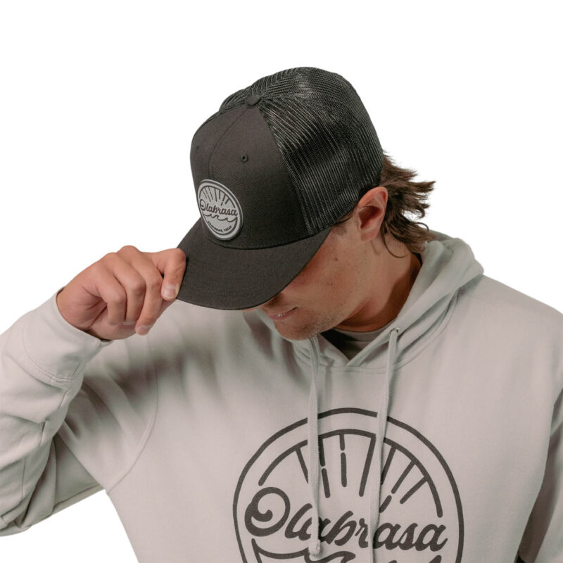 Model wearing Olabrasa OG Curved SnapBack Hat