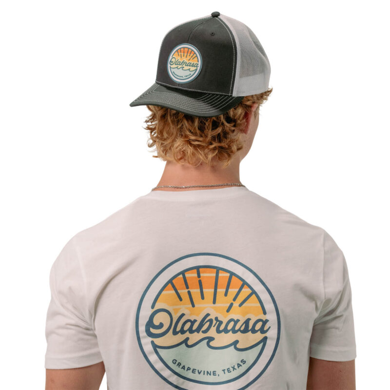 Model wearing Olabrasa OG Curved SnapBack Hat