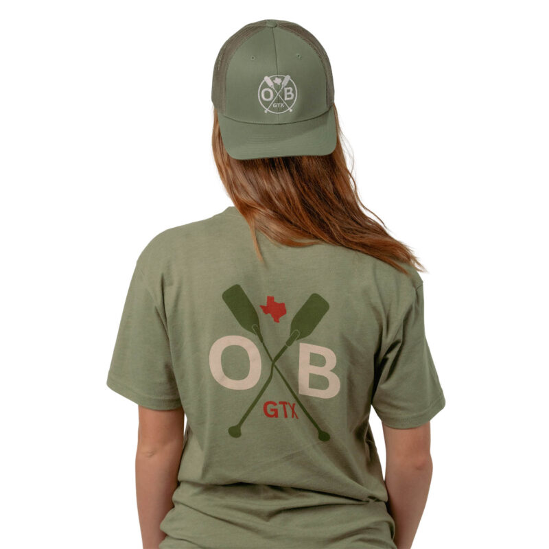 Model wearing Olabrasa SnapBack Curved Hat and Open Paddle T-Shirt