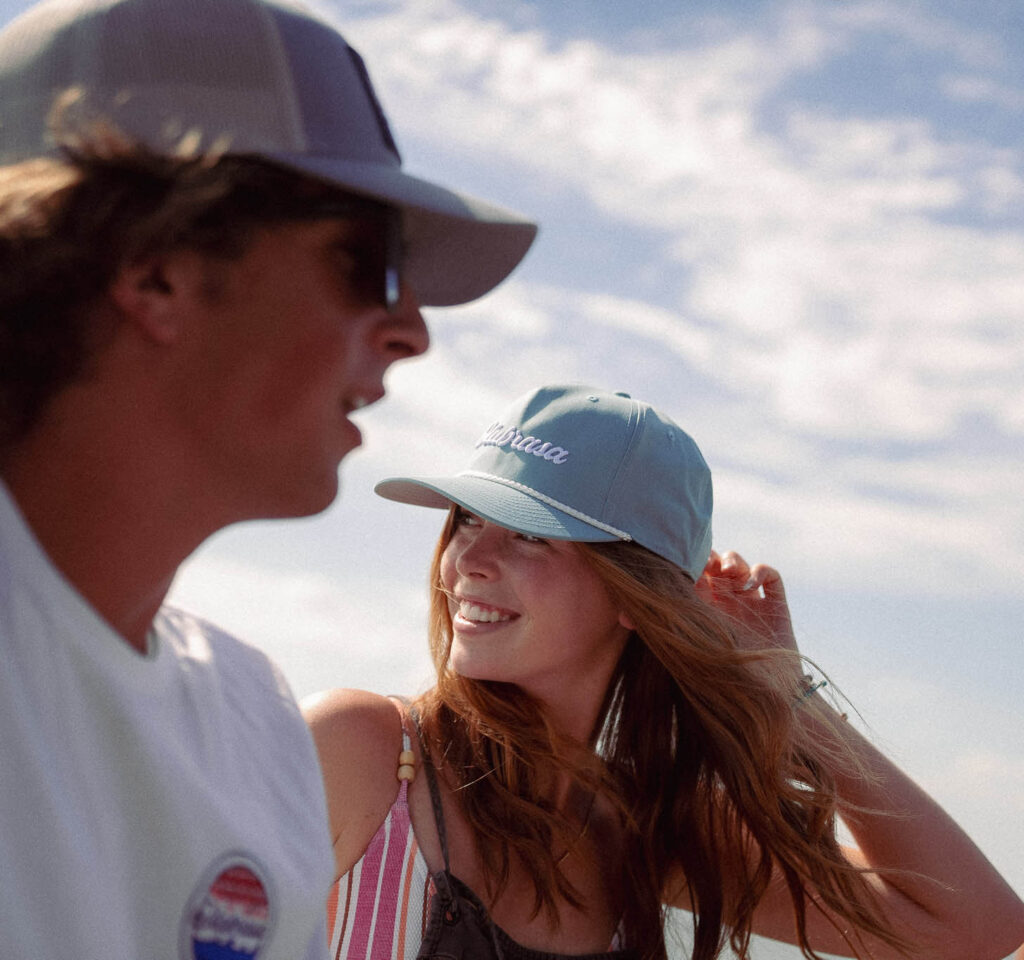 Two people enjoying a sunny day wearing Olabrasa merch.