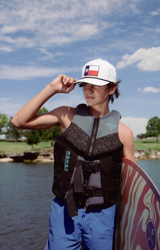 Young surfer wearing the White Texas Forever Rope Curved Hat